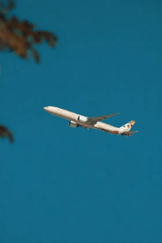 Passenger aircraft in flight against a blue sky